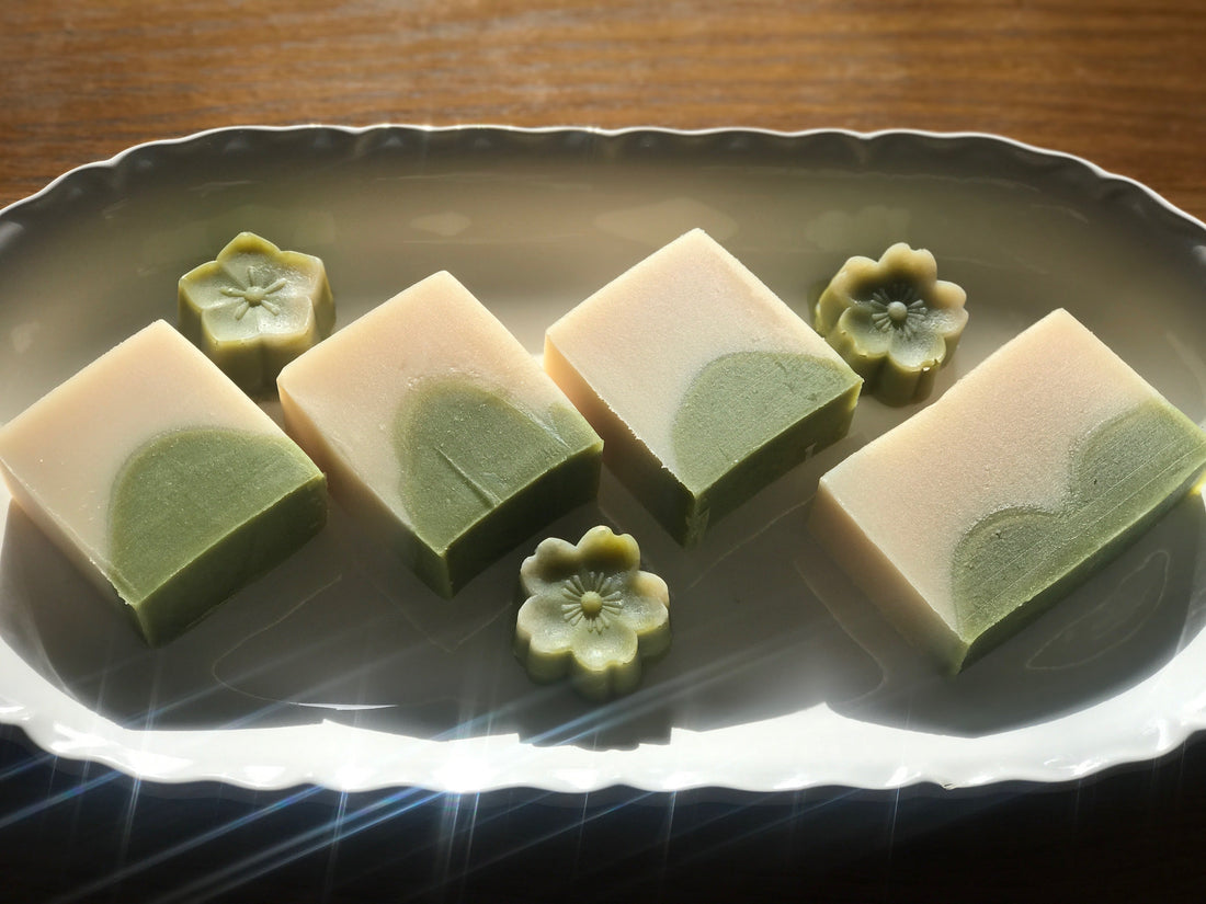 Lemon wheatgrass silk infused handmade soaps on plate.with flower shape mini soap